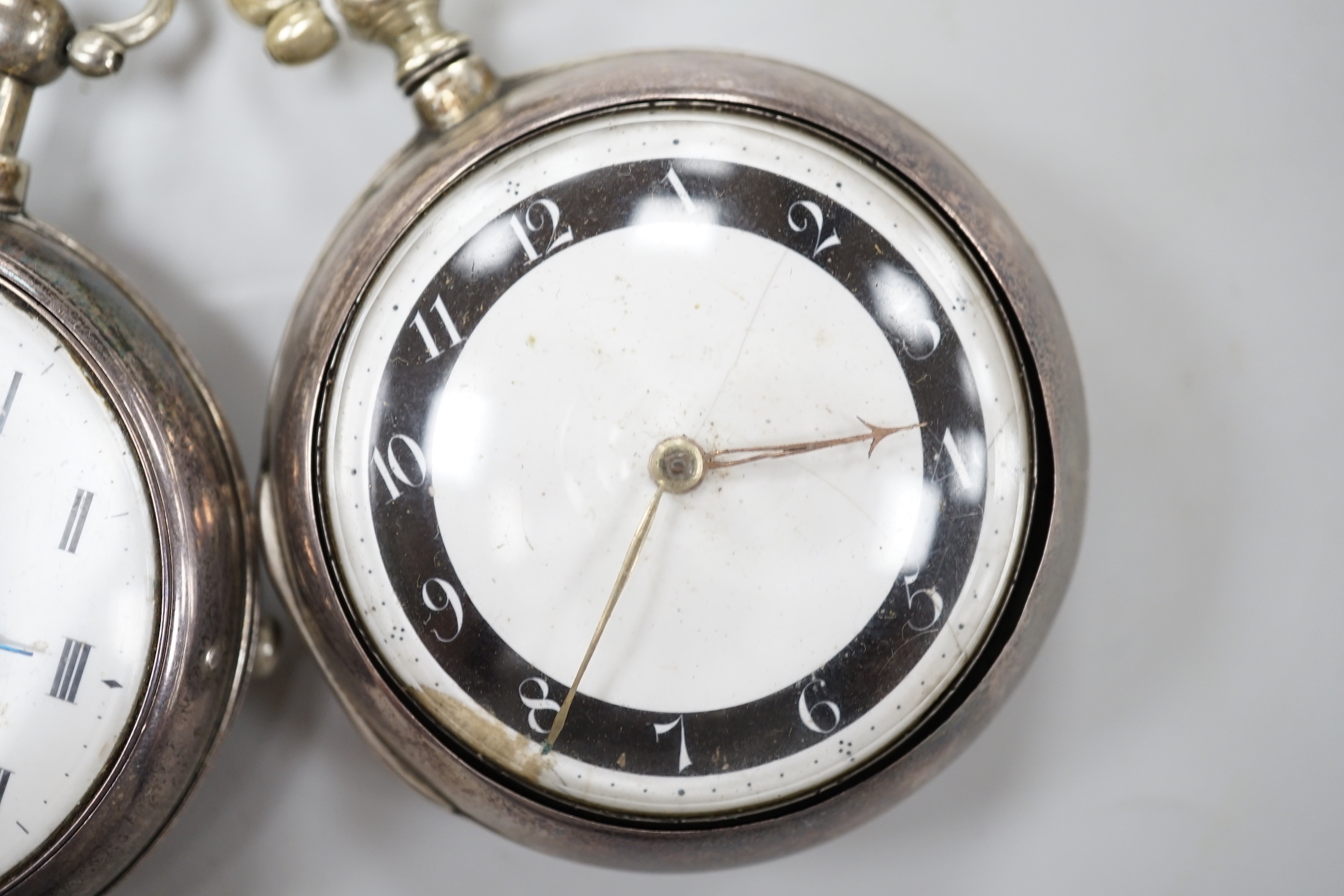 Two George III silver pair cased keywind verge pocket watches by Knight of Thaxted (black ring) and Spink of Windsor.